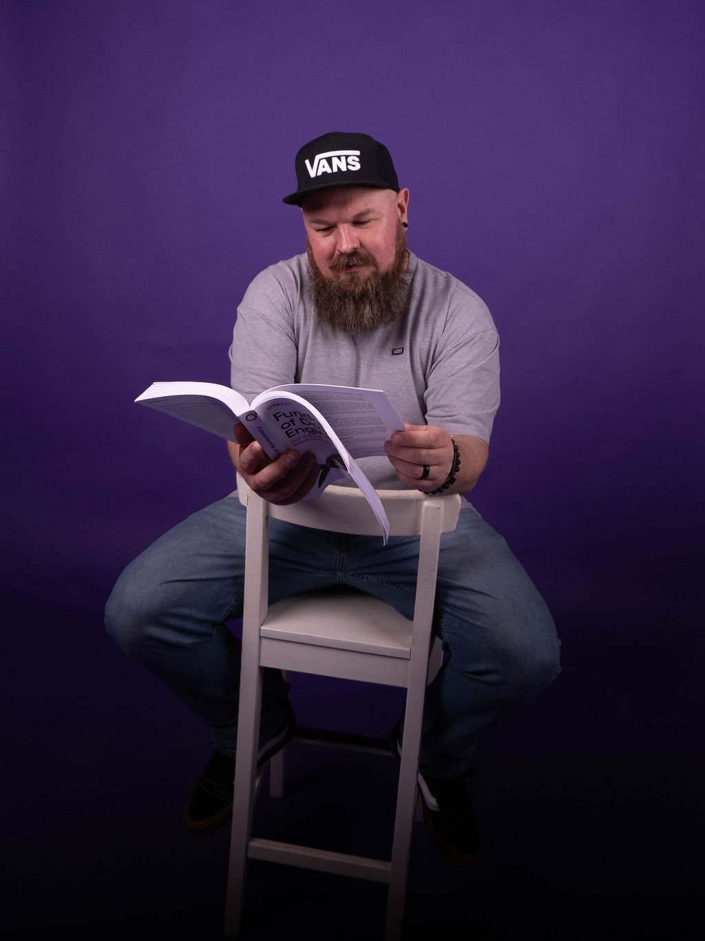 Johnny Winter, founder of Greyskull Analytics, reading a data engineering book