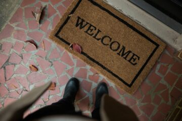 a welcome mat outside of a house